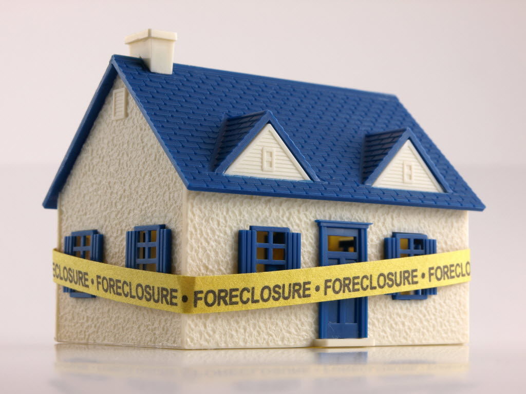 Home Wrapped in Foreclosure Tape