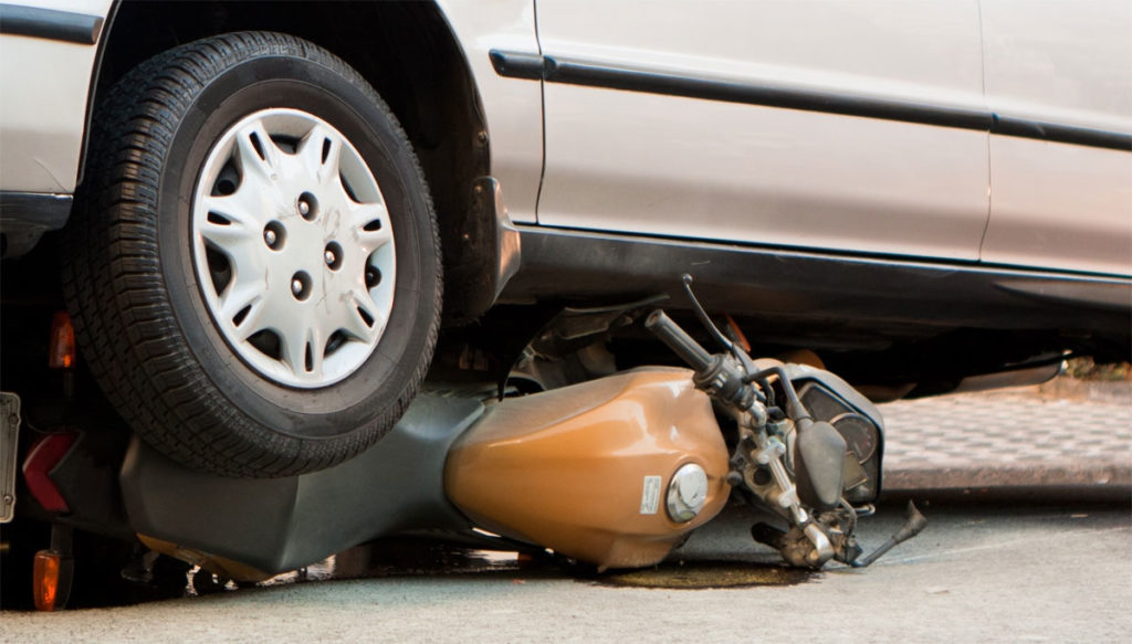 car crushes motorcycle